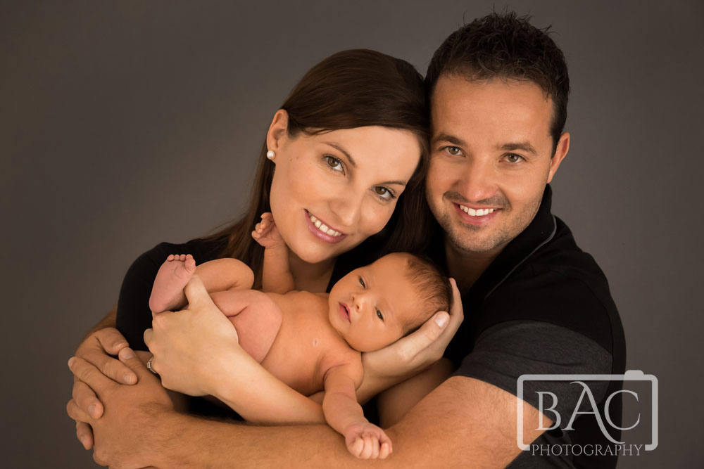 Newborn portrait with mum dad and baby in north lakes studio