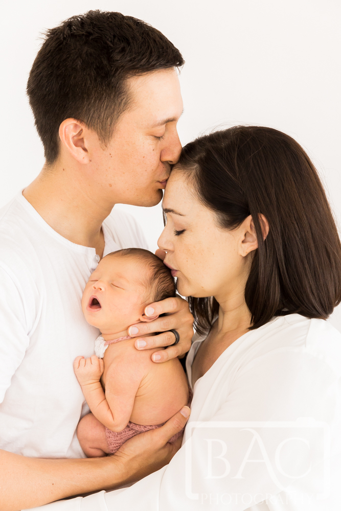 newborn family portrait with mum dad and baby girl