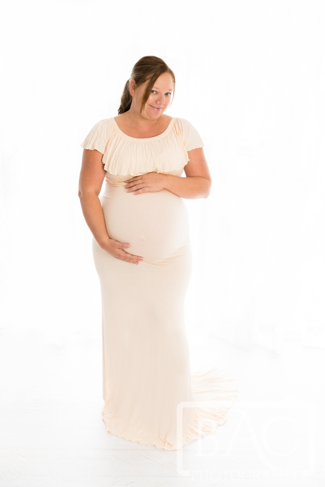 full length backlit maternity portrait