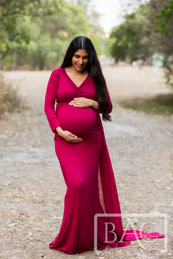 maternity portrait in stunning red dress
