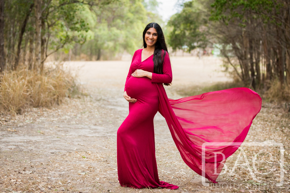 Brisbane outdoor maternity portrait in stunning red dress with chiffon