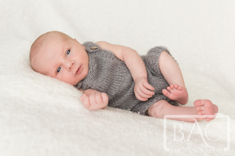  newborn baby boy portrait with eyes open