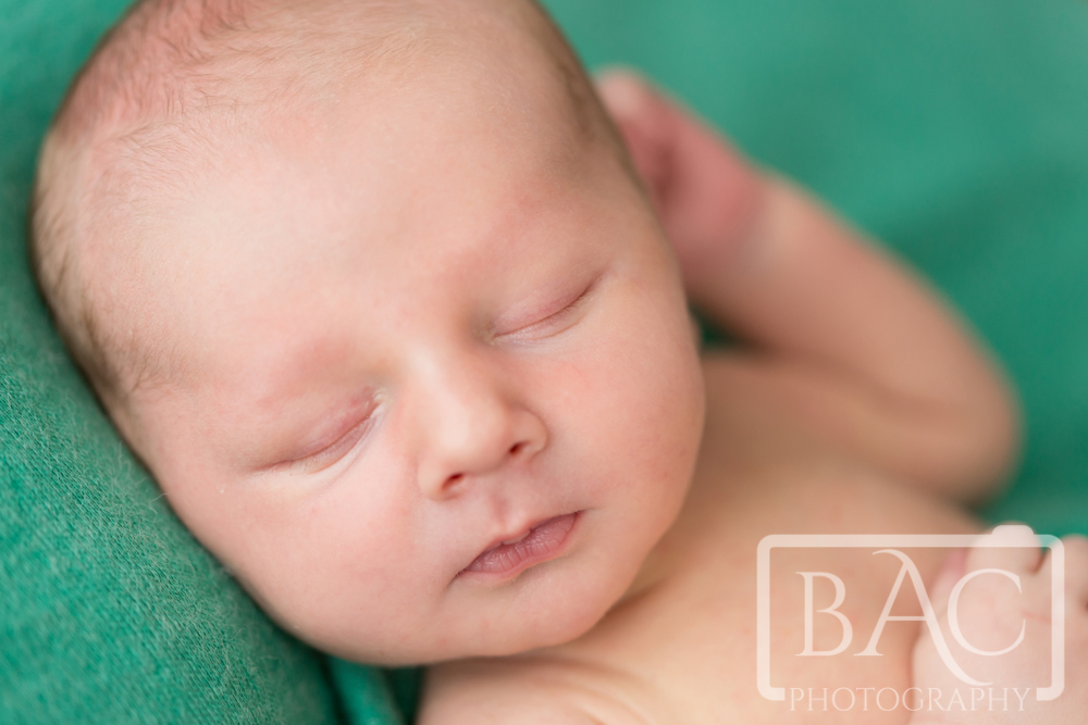Newborn baby boy portrait close up of face