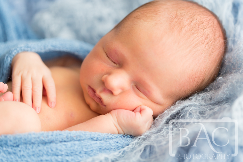 Little newborn boy portrait with close up 