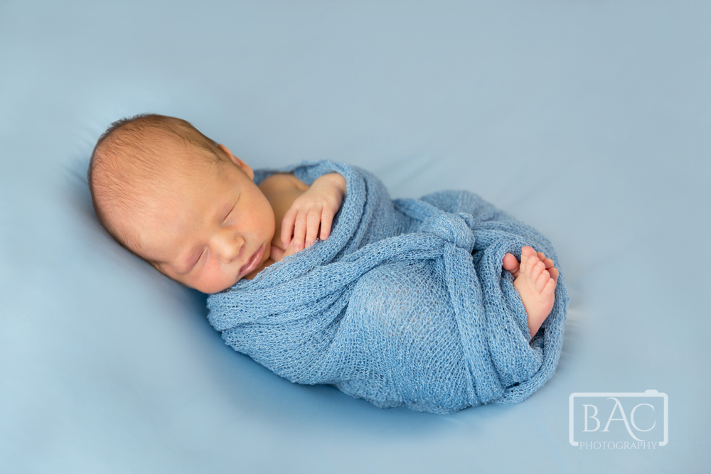 Newborn baby boy in blue