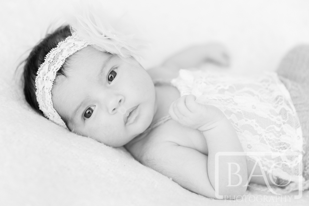 Newborn baby girl studio portrait
