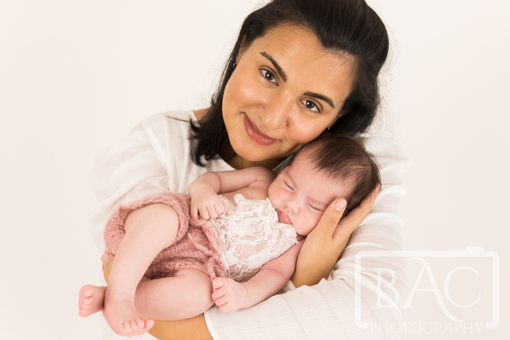 Newborn baby girl portrait with mum