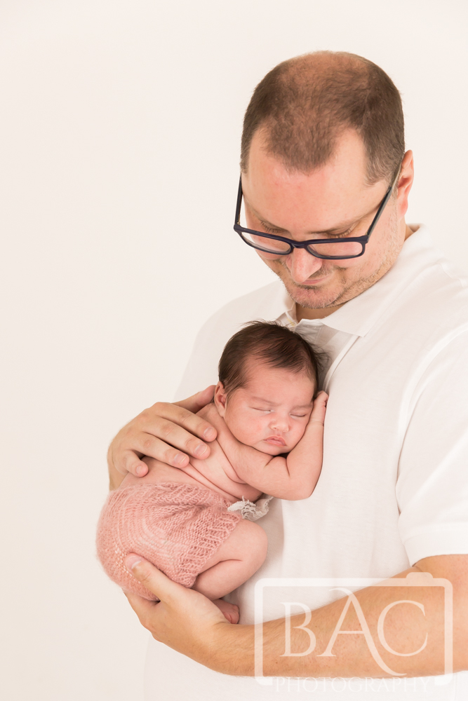 Newborn baby girl portrait with dad