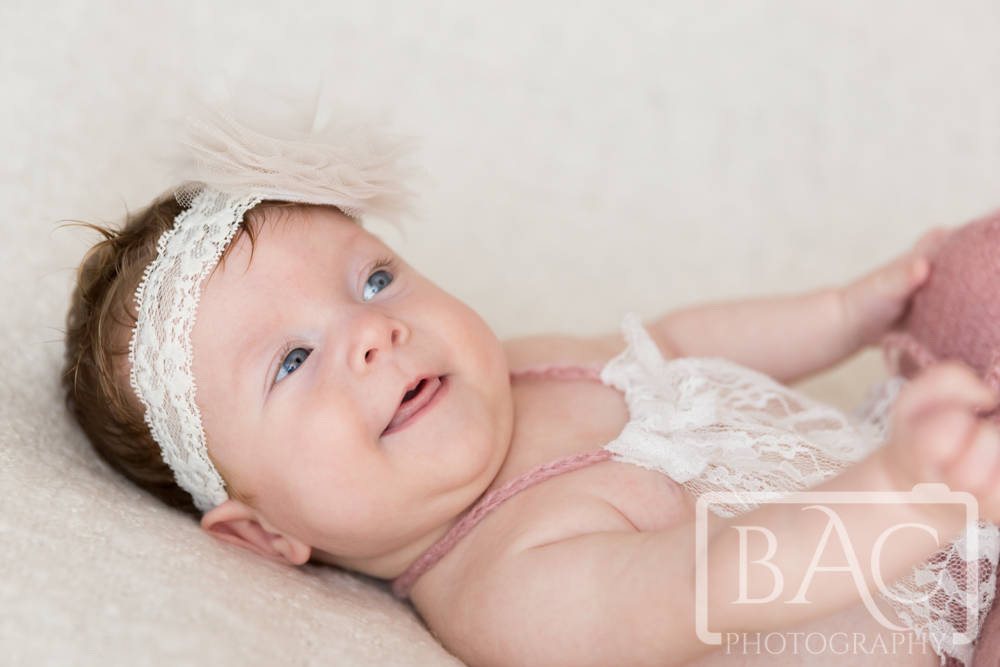 Newborn baby girl portrait with smile