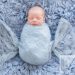 Newborn baby boy wrapped in blue