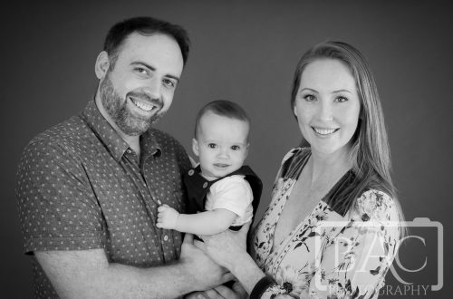 black and white parents and son portrait