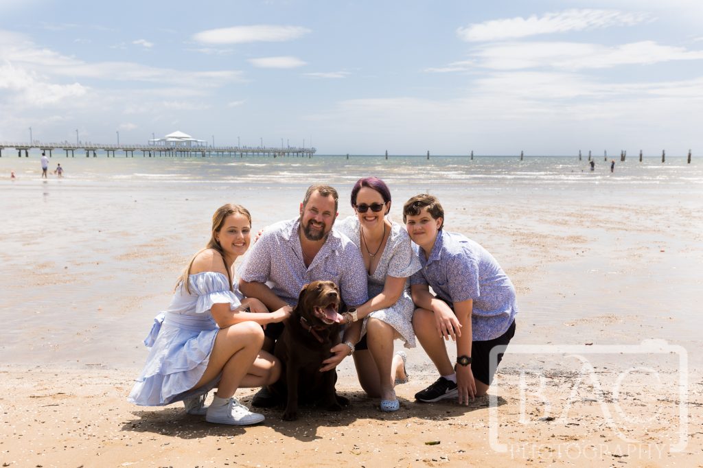 family portrait on beach with dog