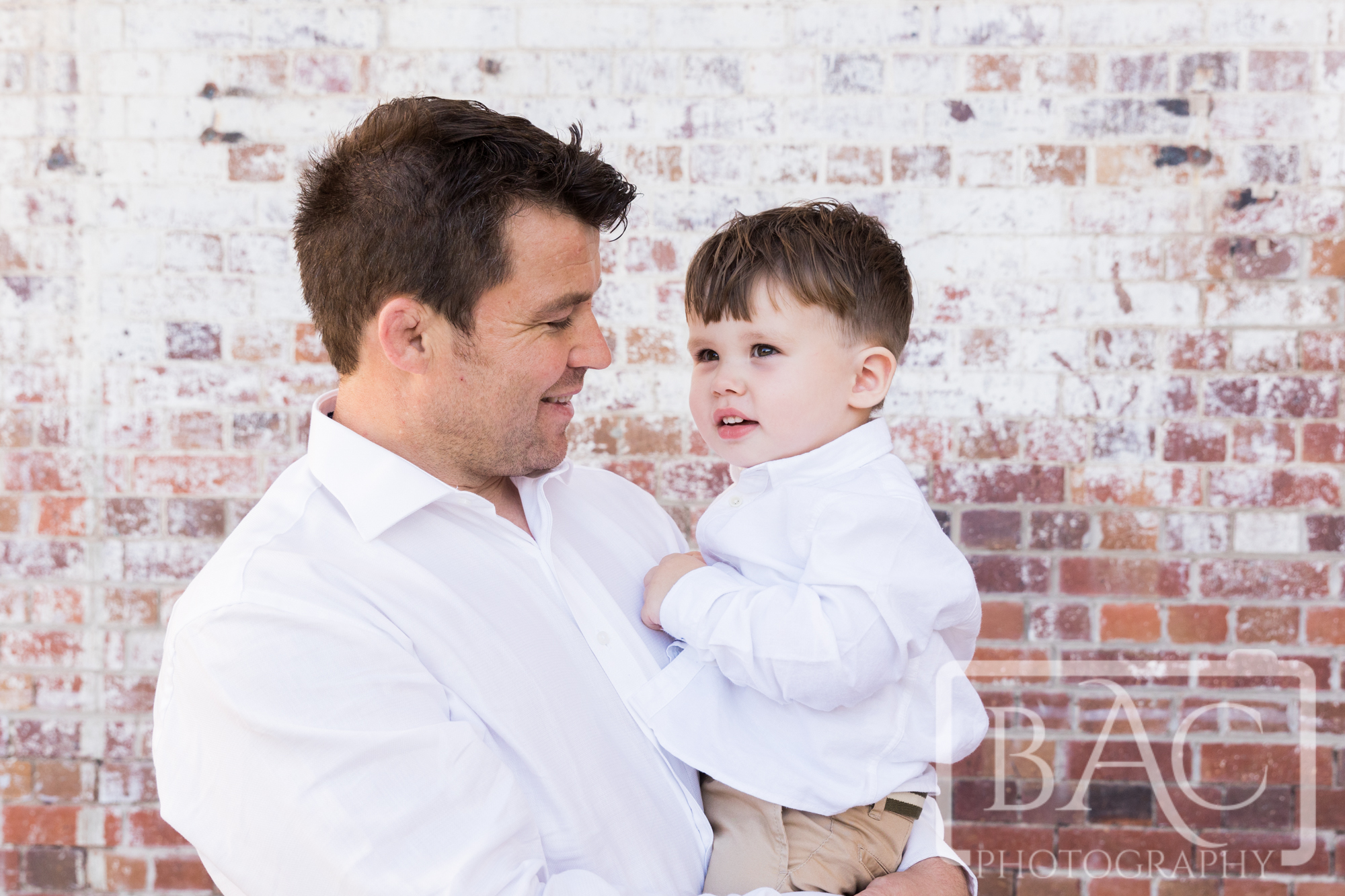 natural father and son portrait outdoors industrial new farm park