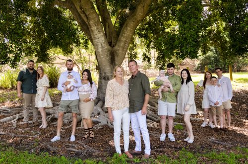 generations outdoor family portrait in green tones under big tree