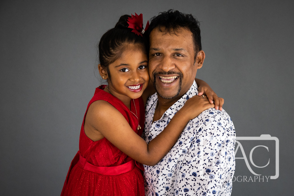 cuddly dad and daughter portrait in studio