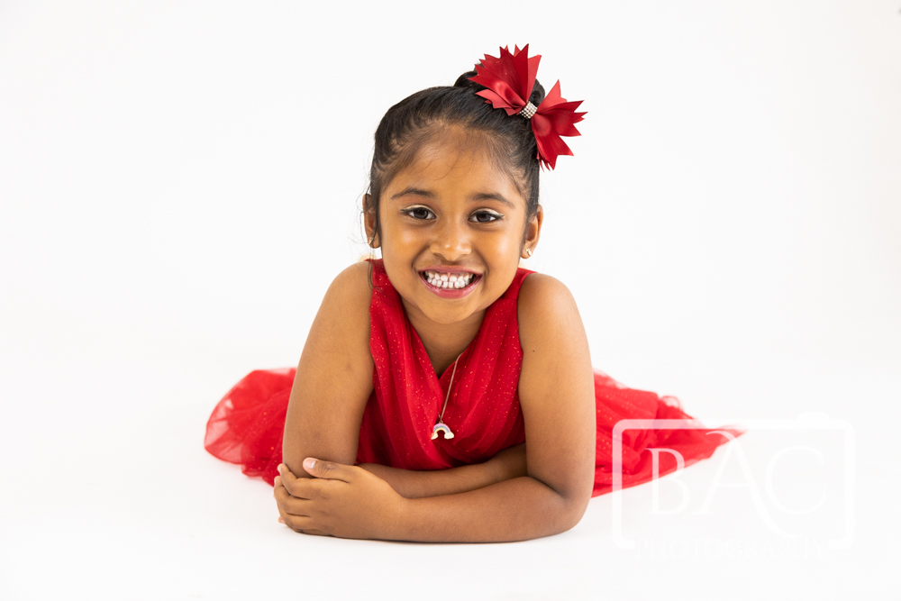 beautiful happy studio portrait young girl in red