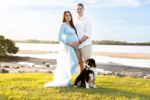 maternity session with puppy pet dog at brighton with beach in the background