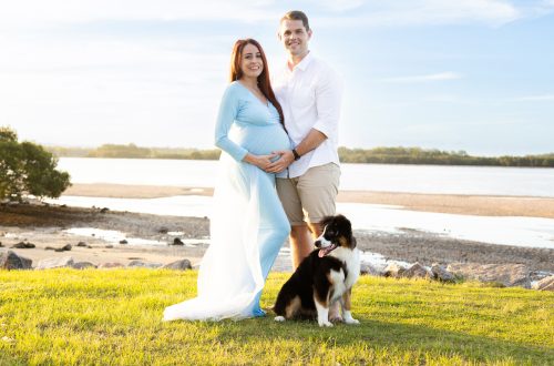 maternity session with puppy pet dog at brighton with beach in the background